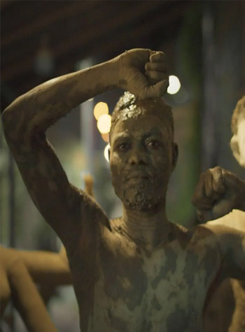 A DOLL MADE UP OF CLAY