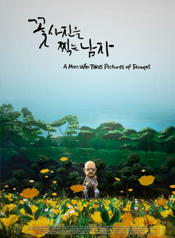 A MAN WHO TAKES PICTURES OF FLOWERS